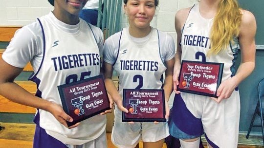 Freshman Nevaeh Irvin (left), freshman Brynn Leschber and sophomore Kassie Jackson posing with their awards after the tournament. Courtesy Photo