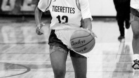 Tigereettes freshman Cynthia Flournoy-Walker dribbles the ball up the court for Thrall. Photo by Larry Pelchat