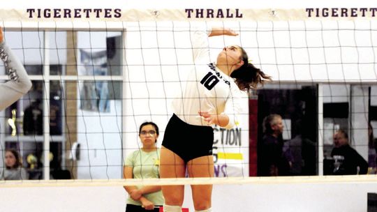 Tigerette’s junior Melaina Grissom spikes the ball during game against Holland. Photo by Larry Pelchat