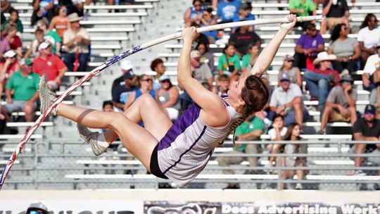 Avery Koonce soaring through the air for the pole vault event on her way to a first place finish. 