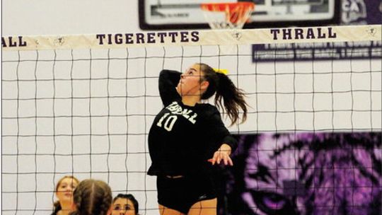 Thrall High School varsity volleyball senior Melaina Grissom gets a powerful kill on Sept. 5 during the Tigerettes’ home match vs. Iola High School. Photo by Larry Pelchat