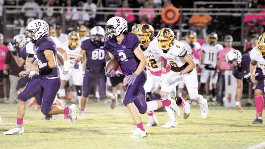 Tigers’ senior Brady Burlison following his blockers looking for extra yards. Photo by Larry Pelchat