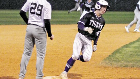 Asa Gibbs rounding third base on his way to adding a point on the score board for his team. Photo by Larry Pelchat