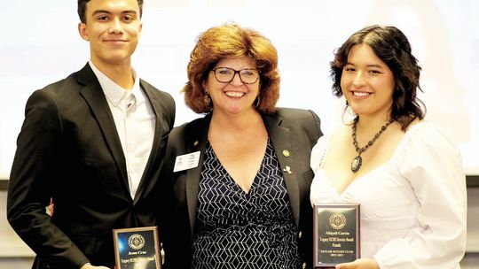 Taylor Rotary Club President Tia Stone (center) presents the Service Award to Jesus Cruz (left) and Abigail Garcia, seniors at Legacy Early College High School in Taylor at the May 1 Rotary Scholars Banquet. Courtesy photos