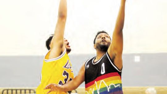 BJ Tealer (right) takes a shot against defender Eric Martinez at last year’s Taylor Press 3-on-3 Basketball Tournament. The event is scheduled for July 8-9 at Taylor High School. Photo by Larry Pelchat