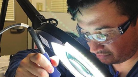 Peter Wilson, of Georgetown, repairs a power distribution board for a bar-code printer at ICU Medical in Austin. Wilson, a graduate of TSTC’s Industrial Systems - Mechanical Specialization program, was hired last December after completing an apprenticeship during the fall semester. Courtes...