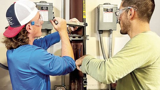 Texas State Technical College Industrial Systems students Richie Cooper (left) and Alejandro Garcia Puente install a ball valve on an air line during a recent lab session at the East Williamson County campus in Hutto. Courtesy photo / TSTC