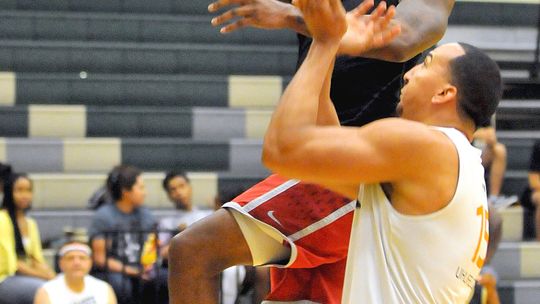 Chuck Okpalaeze (left) goes for a layup in the championship game of the Taylor Press 3-on-3 Basketball Tournament July 14, 2019. The Tournament returns this summer. Call 512-352- 8535 for more information. Photo by Larry Pelchat