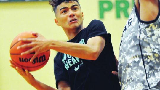 A player goes for a basket during a past Taylor Press 3-on-3 Basketball Tournament. The Tournament returns this weekend. Photo by Larry Pelchat