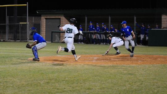 Cohen Tyree scores crosses home plate to put the Ducks ahead 2-0 early in the game against Copperas Cove. 