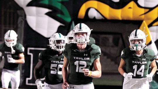 The Taylor Ducks run out of the tunnel for the second half against Robinson.v