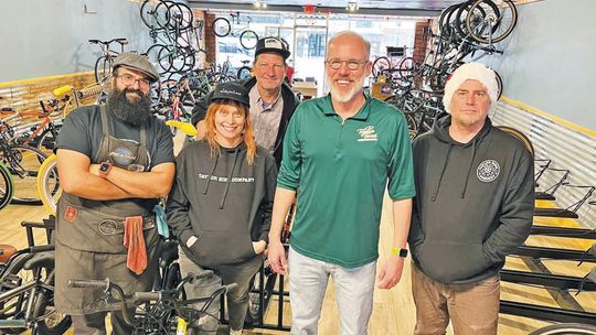 (From left) Eddie Chavez, Shannon Chavez, Vytis Vardys, Mayor Brandt Rydell and John Chisholm take a moment to pose together Dec. 16 at Taylor Bike Co. Photo courtesy of Brandt Rydell