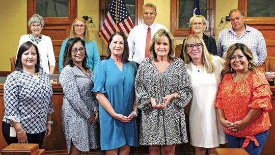 Top row from left to right: Commissioner Terry Cook, Commissioner Cynthia Long, County Judge Bill Gravell, Commissioner Valerie Covey, Commissioner Russ Boles. Bottom row from left to right: Deanna Saucedo, Lisa Bell, Cathy Mendoza, Lisa David, Alison Gleason, Alvina Galvan.