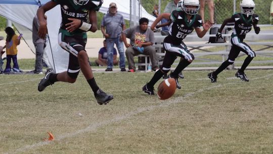 The Taylor Youth Ducks kicking off against Rockdale for their semi-final matchup. Photo by Vershiba Cook