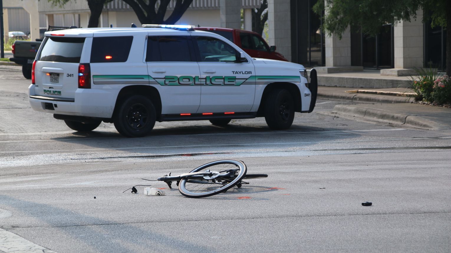Cyclist struck, dragged by car on Main Street, police say