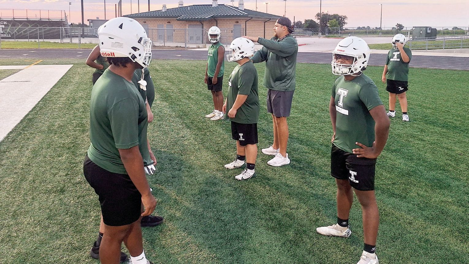 Taylor football opens fall camp with energy, focus