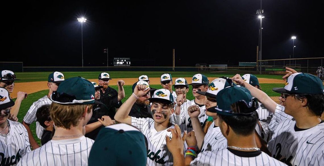 Taylor varsity baseball junior Devin Valdez (center) talks to his teammates following the Ducks’ 7-2 victory at home vs. Navarro. 