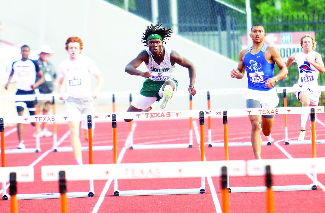 Taylor senior Jarvis Anderson clears a hurdle and increases his lead in the 4A boys’ 300-meter hurdles state finals in Austin on Thursday. Photos by Briley Mitchell