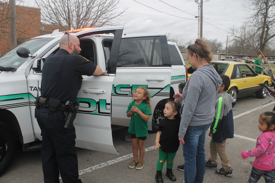 Sgt. Sam Brister (left) talks with children during the Truck Petting Zoo at the Taylor Public Library in Taylor March 17.   Photo by Fernando Castro