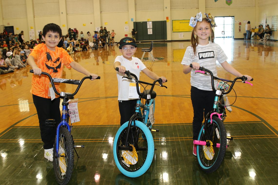 Pasemann students (from left) Hugo Marquez (fourth grade), Rhett Barcuch (second grade) and Kyleigh Harding (third grade) are shown with the new bikes they were awarded for good behavior.tudents with no office referrals for the first nine weeks of school were entered into a drawing for a c...