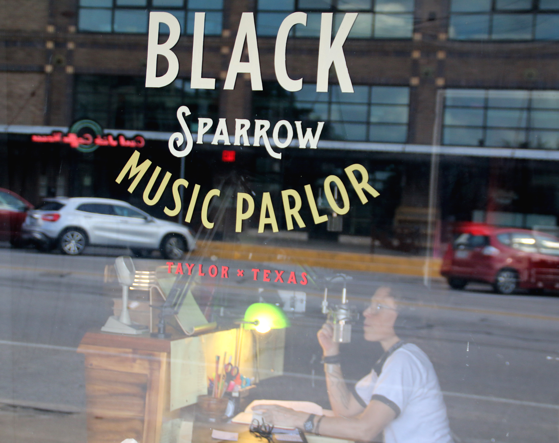 Black Sparrow owner Shannon Bagent records at the KBSR headquarters. Photo by Jason Hennington