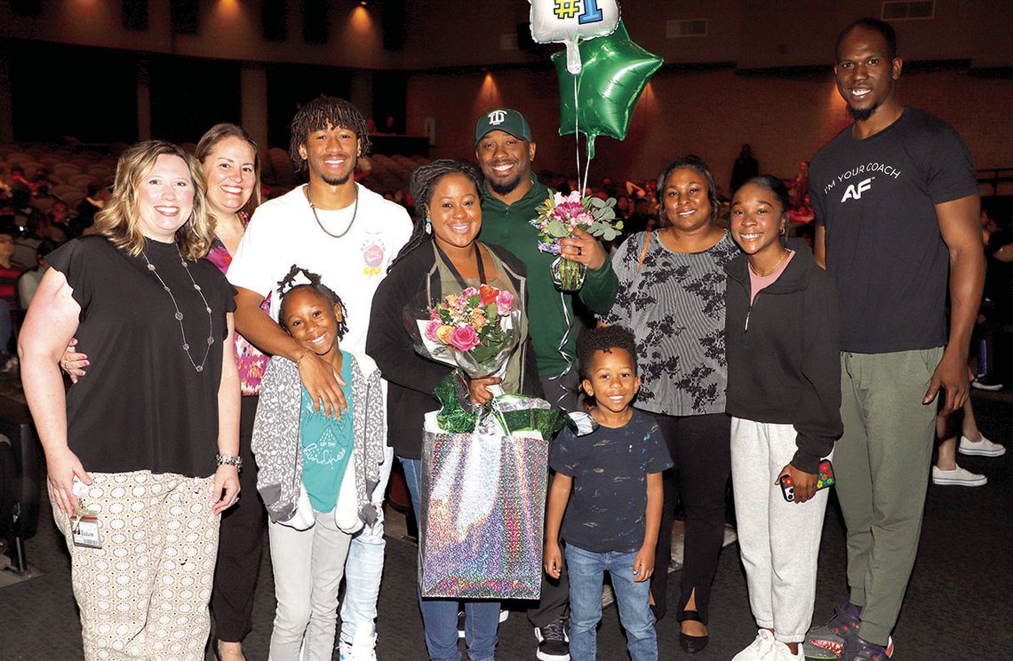 Main Street Intermediate School’s Teacher of the Year, Iris Bunton, is surrounded by family members and campus administrators. Photo by Tim Crow