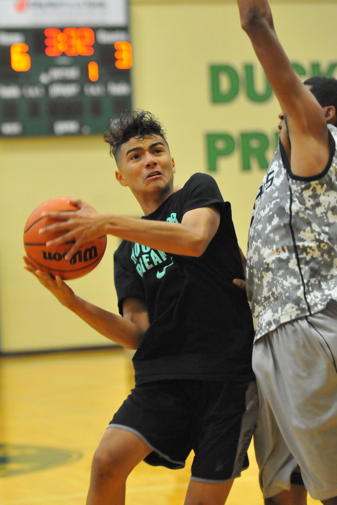 A player goes for a basket during a past Taylor Press 3-on-3 Basketball Tournament. The Tournament returns this summer. Photo by Larry Pelchat