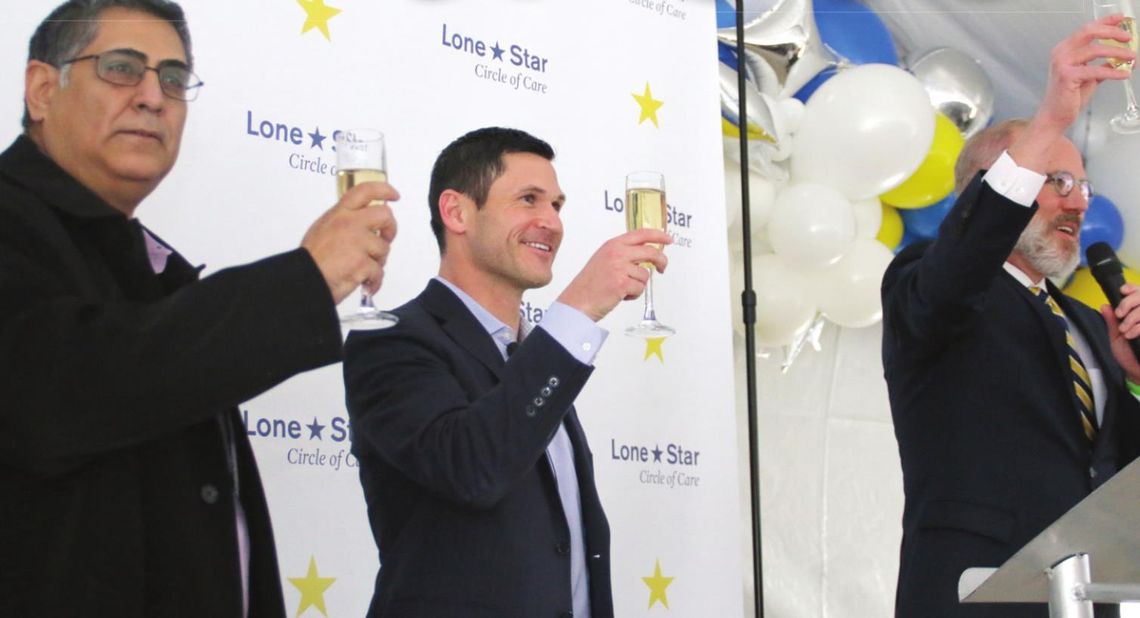 (From right to left) Mayor Brandt Rydell proposes a toast with Jon Calvin, CEO, and Marco Cruz, Executive Director, to celebrate the opening of Lone Star Circle of Care. Photos by Jason Hennington