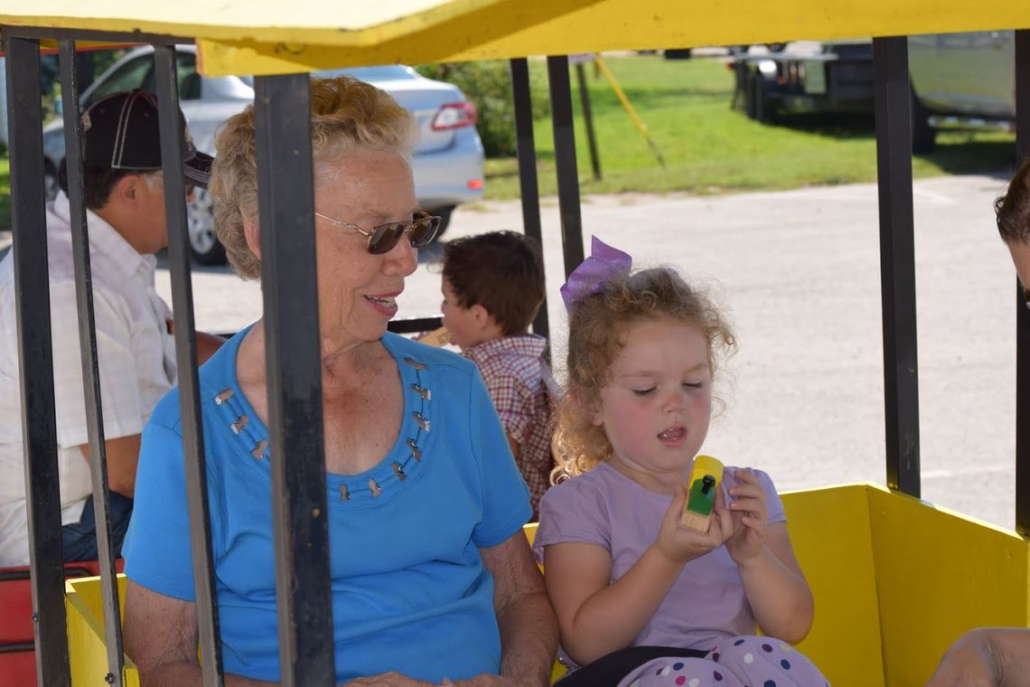 At a past Choo Choo Fest, Coupland City Secretary LaVerne Rohlack and her granddaughter Amelia Cotterill enjoy riding the Kiddie Express Train. Photo by Kyle Hensley