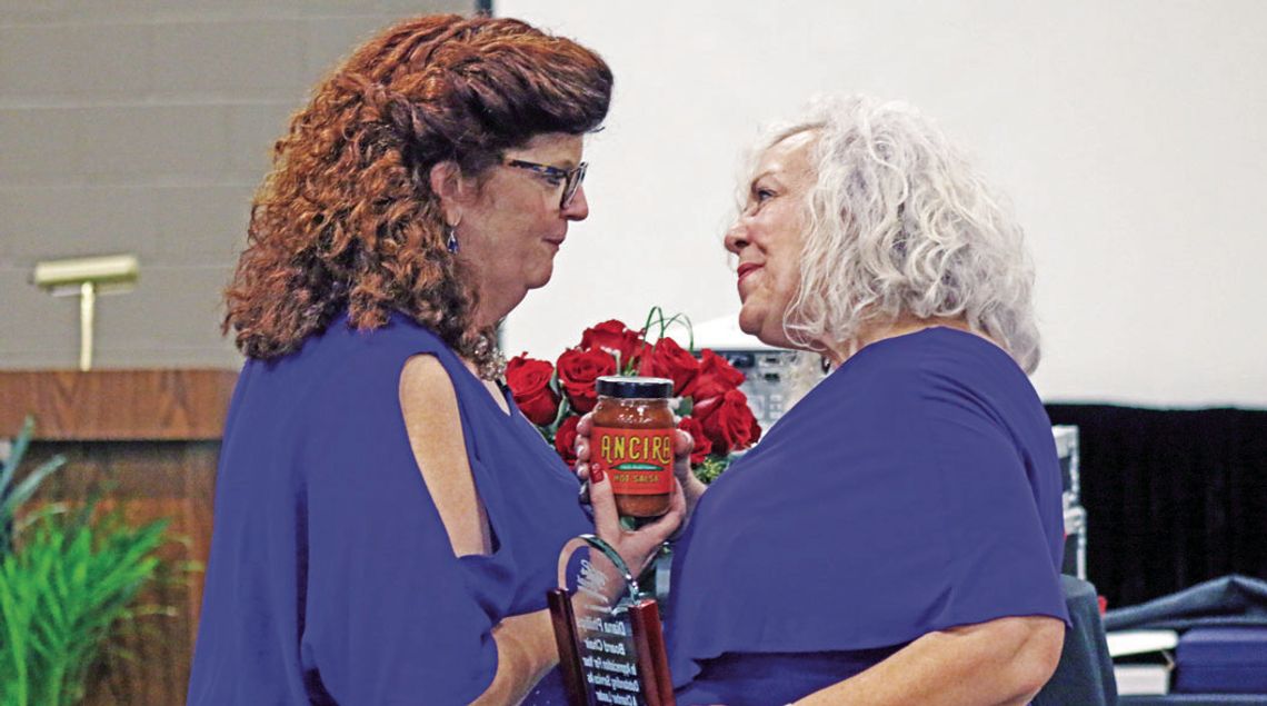 Chamber President Tia Stone (left) thanks outgoing chair Diana Phillips for her work on the Chamber Board of Directors. Photo by Jason Hennington