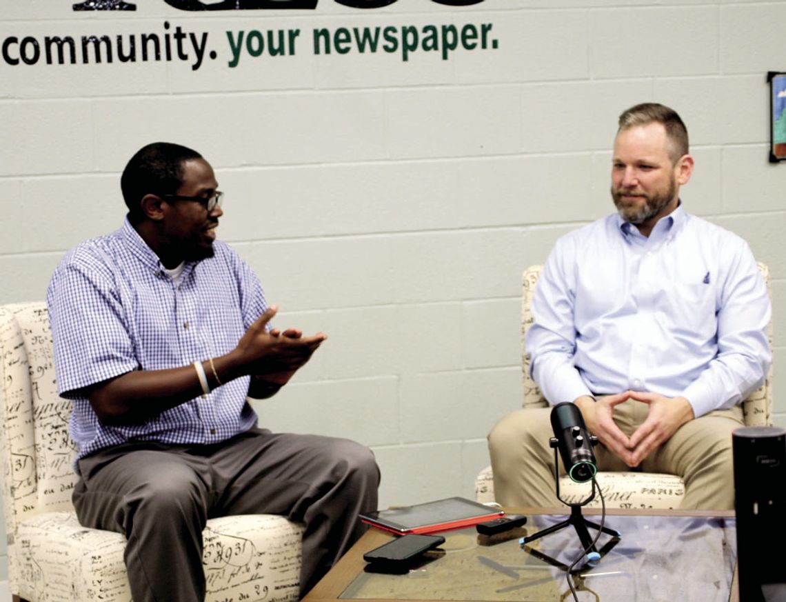 Taylor Press Area Editor Jason Hennington chats with City Manager Brian LaBorde Dec. 12 at the Taylor Press studio. Photo by Nicole Lessin