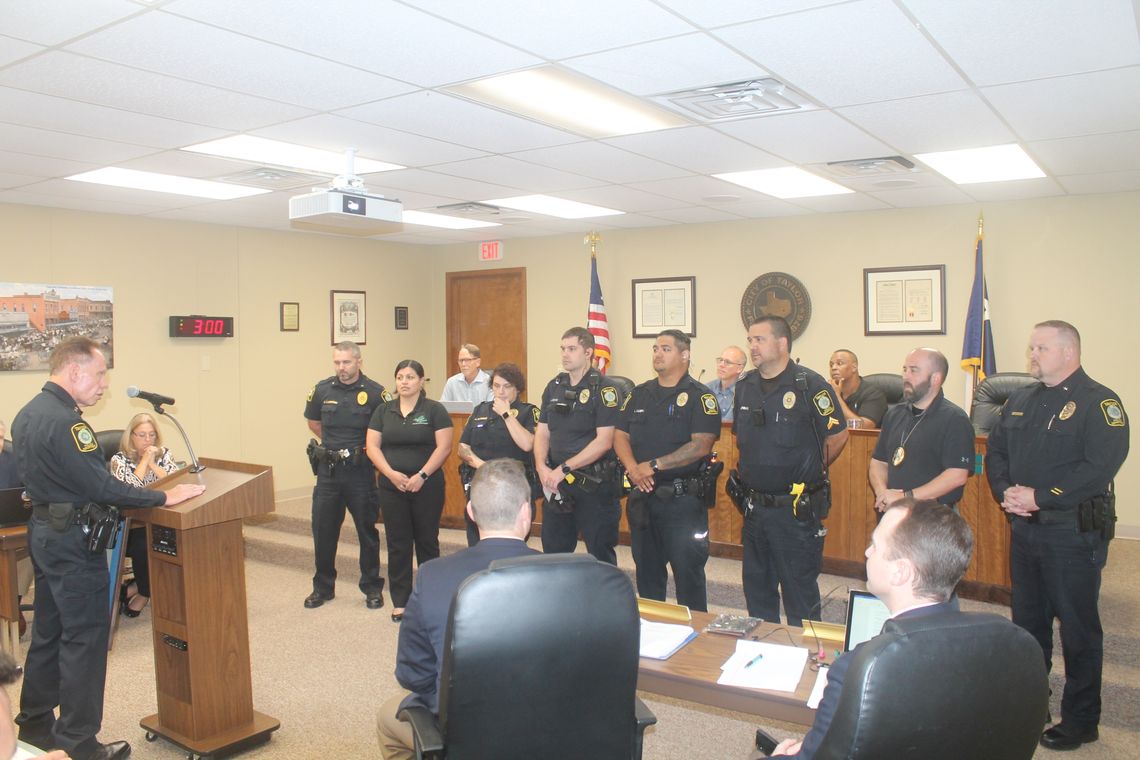 Members of the Taylor Police Department listen to Chief of Police Henry Fluck during a recognition at the City Council meeting in Taylor July 22, 2021. Photo by Fernando Castro