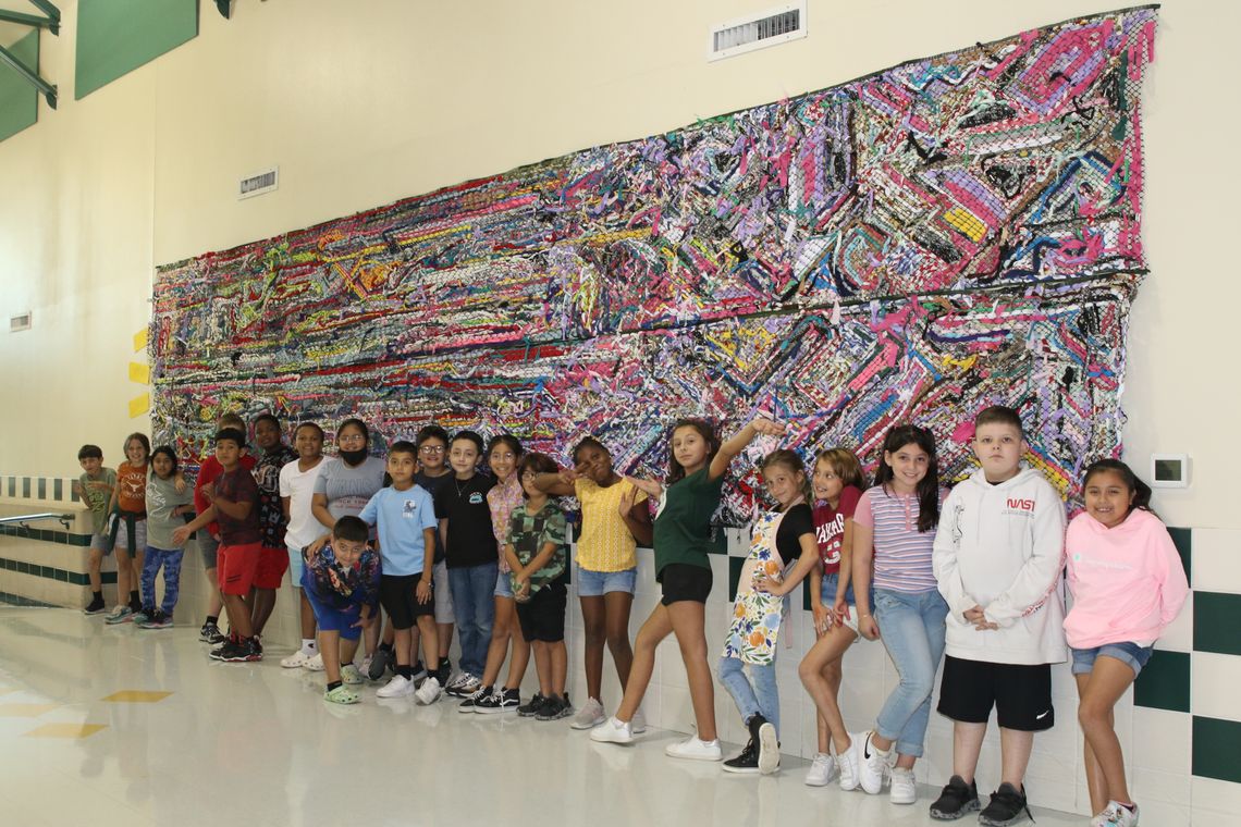 Naomi Pasemann Elementary students participated in a school community art project that involved weaving materials together to produce a mural for their school. The project was completed by art students under the direction of NPE art teacher, Jennifer Lindquist. Photo by Tim Crow