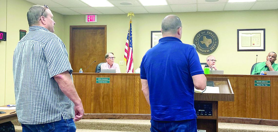 (From left) Mike Hickey, the senior project manager of the broadband division for Mears, and John Fetter, ISP market manager with Fiber First, answer questions from the City Council at the regular meeting June 22. Photo by Nicole Lessin