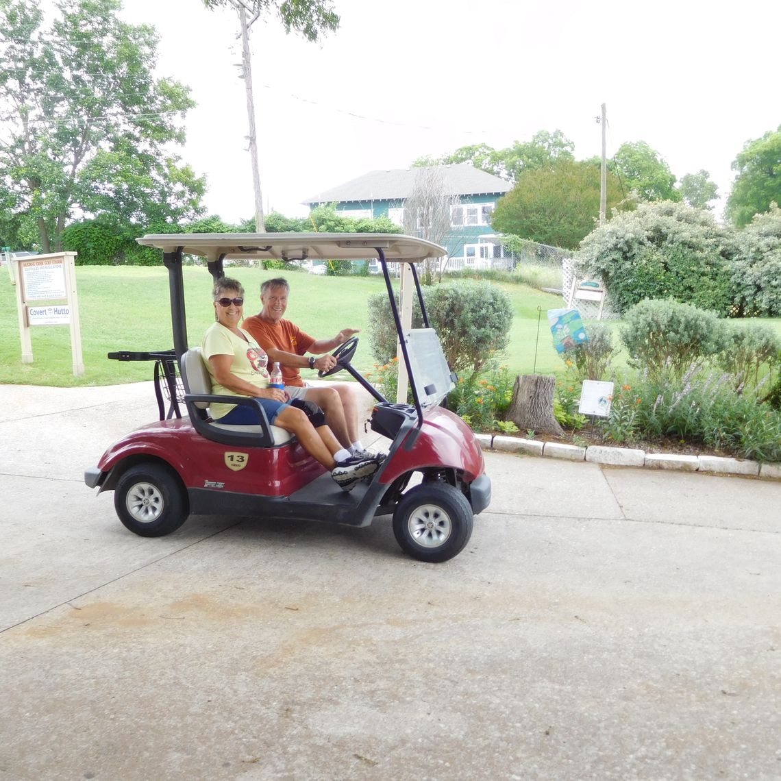 CCO Assistant Treasurer Becky Sutton and Coupland Mayor Jack Piper start out to observe the play at a previous CCO golf tournament. This year’s will be Aug. 6. Photo by Susan Garry