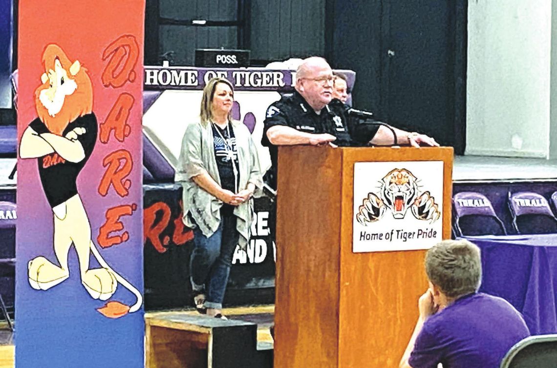 Sheriff Mike Gleason talks with students at Thrall Middle School Jan. 14 during their D.A.R.E. graduation. Facebook / Thrall Middle School