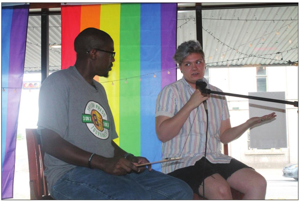 Jason Hennington talks with Red Bailey about the upcoming Taylor PRIDE festival during an interview at Texas Beer Company in Taylor June 15. Photo by Fernando Castro