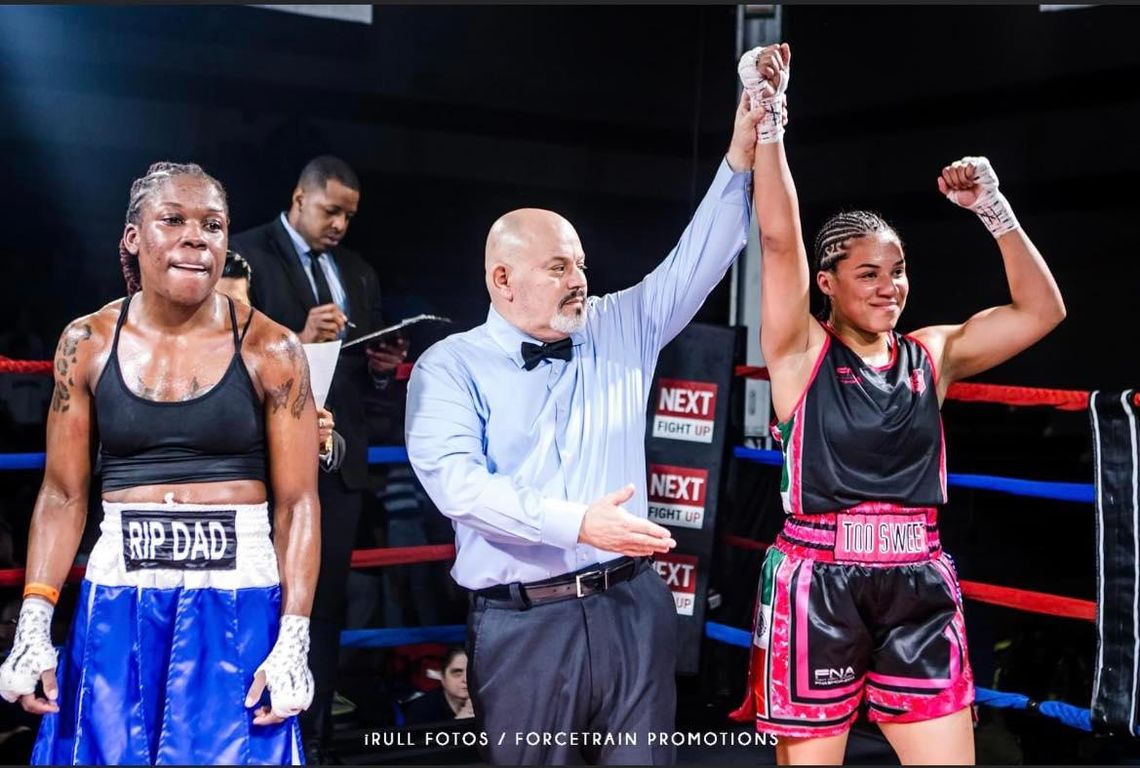 Victory is “Too Sweet” for Destiny Jones (right) as she is declared the winner after a fight against Clarice “Reese” Morales.