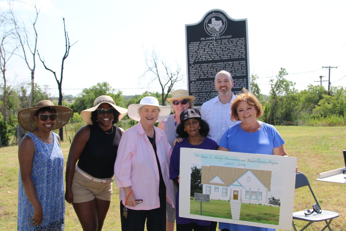 Dickey Museum board members and representatives from the Texas Historical Foundation attend a press conference to announce a $500,000 grant from the St. David's Foundation that will be used to build a replica of the home of Dr. James Lee Dickey. At the event are (from left) Linda Jackson,...