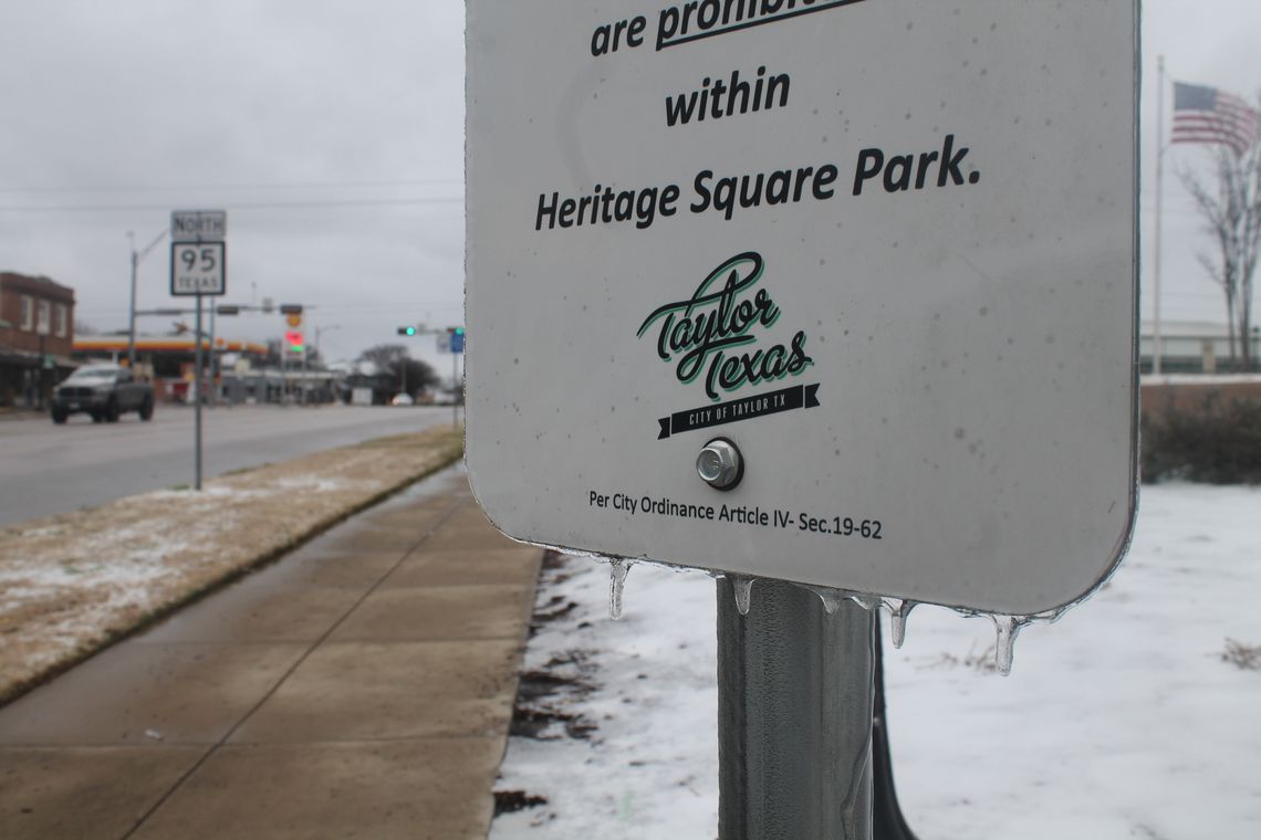 A sign on Heritage Square in Taylor drips with ice Feb. 4. Photo by Fernando Castro