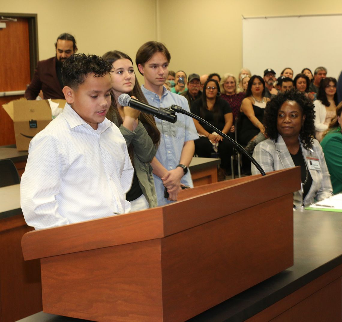 A. J. Sanchez, Lacey Thompson and Ben Bachmayer represent Taylor Middle School in expressing thanks to school board members for all they do to support students and learning.