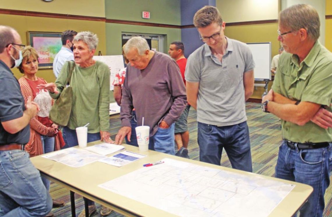 Residents take a look at some of the results from Halff Associates on Taylor’s Drainage Master Plan study during the workshop at the Taylor Public Library Nov. 16, 2021 Photo by Fernando Castro