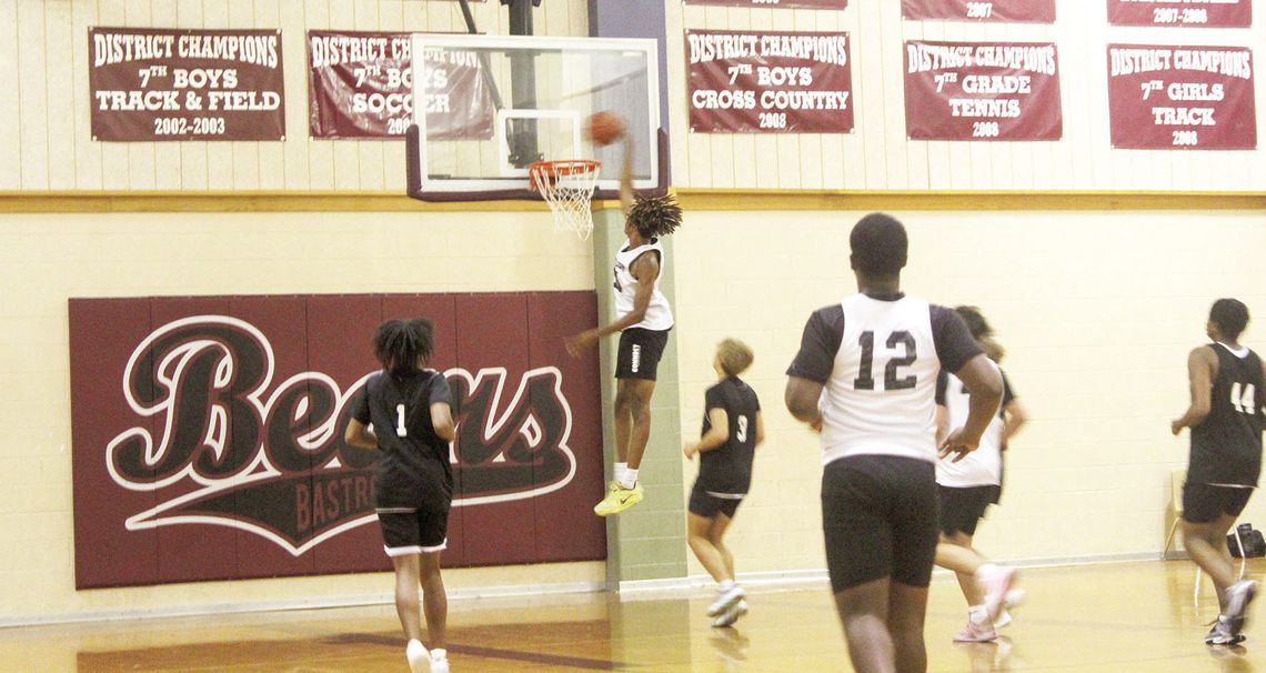 Taylor High School boys varsity basketball senior Treos Richardson soars through the air for a dunk on Monday, June 26 during the Ducks’ summer league scrimmage vs. Cedar Creek High School in Bastrop. Photos by Andrew Salmi