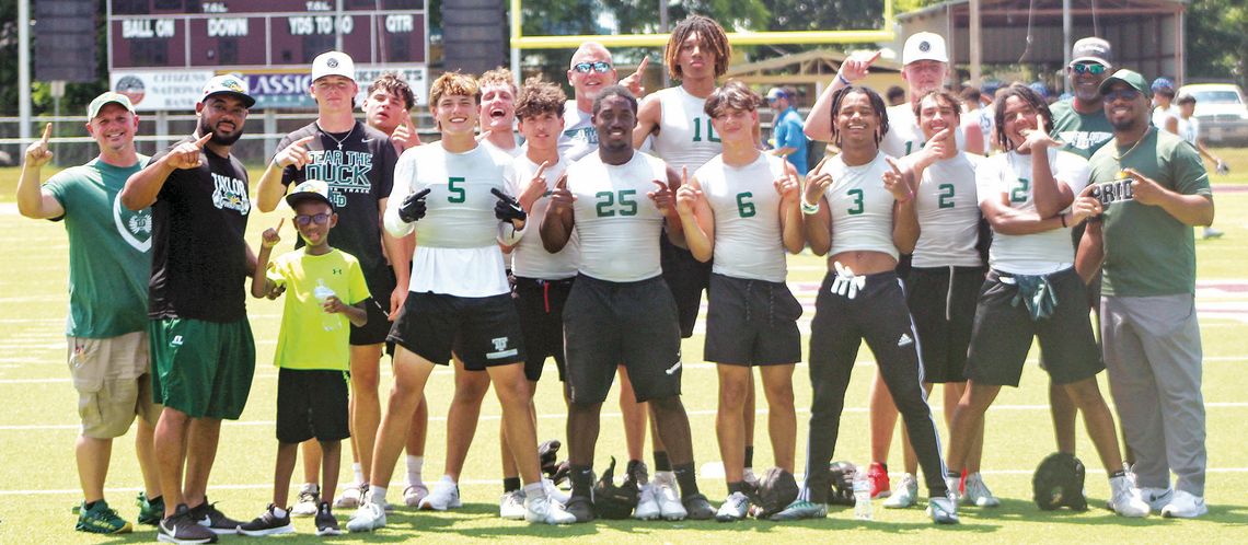 Members of the Taylor High School varsity football team and coaches celebrate on Saturday, June 10 after defeating Yoakum High School 20-19 at Yoe Field in Cameron following a 7-on-7 state qualifying tournament. Photos by Andrew Salmi