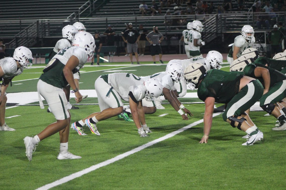 The Ducks' front seven gets ready for the snap on Aug. 17 during Taylor's scrimmage against Franklin at Hedrick Field. Photo by Andrew Salmi