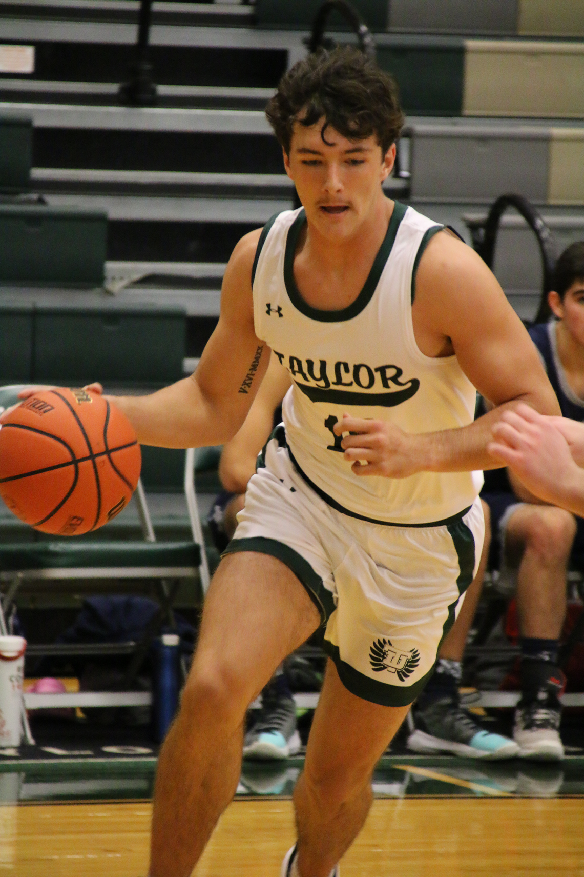 Ducks senior Conner Cobb driving towards the basket looking for a layup. Photo by Larry Pelchat