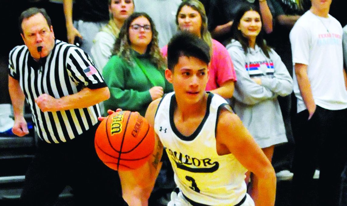 Ducks senior Landon Velasquez dribbling the ball up the court on a fast break. Photo by Larry Pelchat