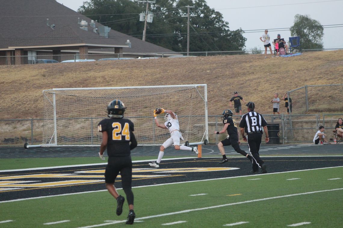 Ducks varsity football senior wide receiver Jacob Mikulencak makes an acrobatic catch for a touchdown on Friday night in Taylor's season opener at Gatesville.