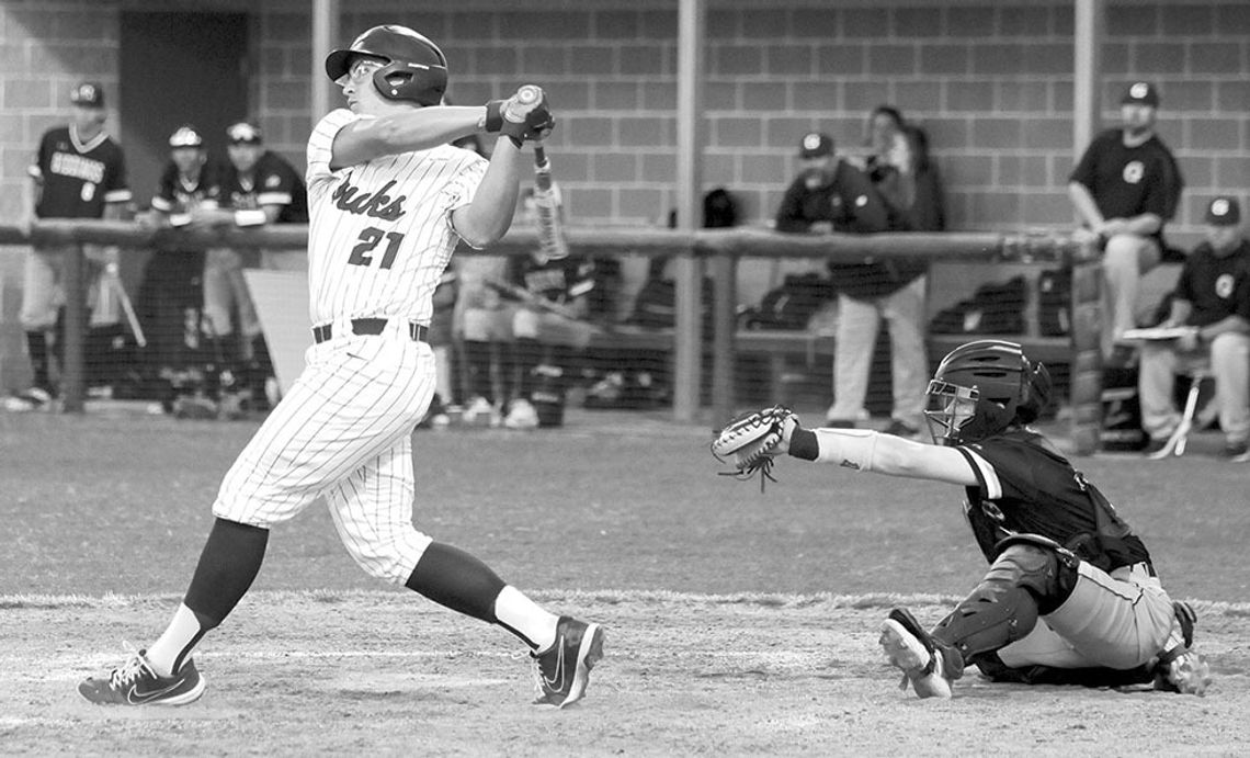 Braylan Alderete swinging hard and putting the ball into play for a base hit. Photo by Larry Pelchat