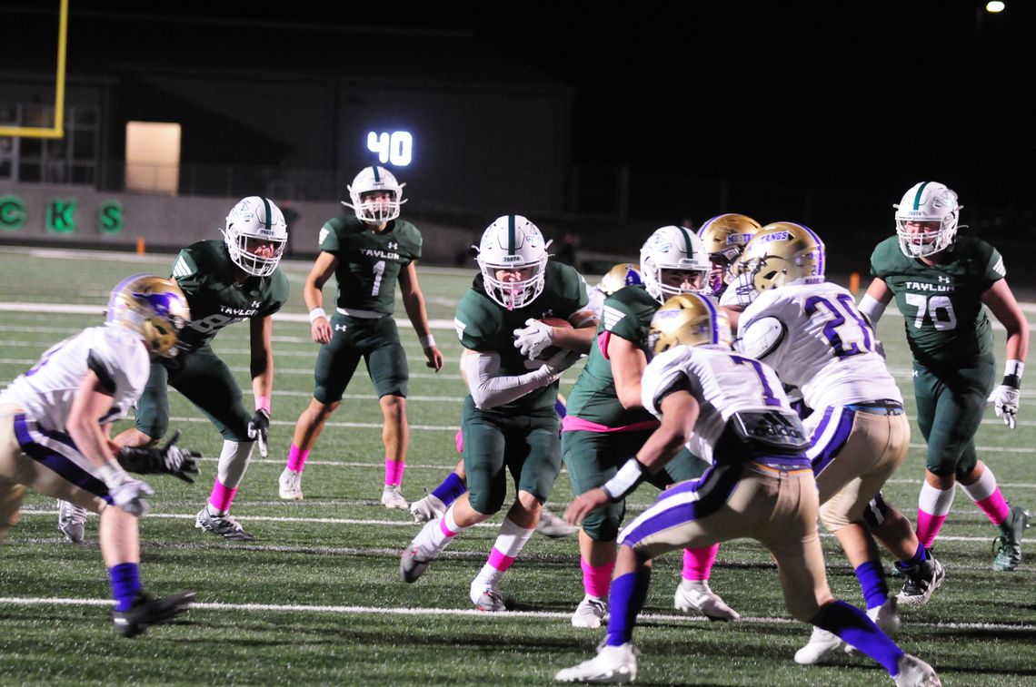 Ducks win first district game in four years. They defeated Marble Falls at the Duck Pond Friday night. Ducks’ junior Jackson Meller puts two hands on the football and braces to run through tackles from Marble Falls defenders. Photos by Larry Pelchat